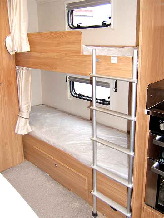 View of the fixed bunk beds to the rear of the caravan.